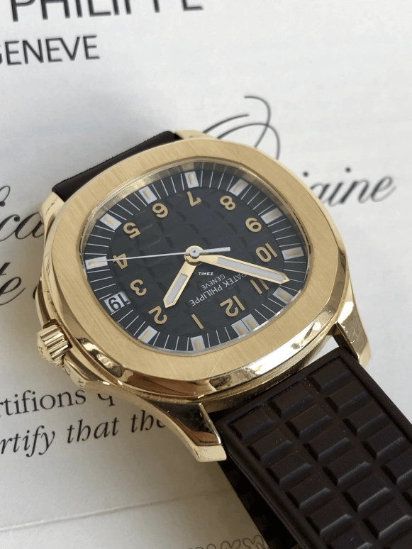 Patek Philippe,Aquanaut 38mm,38mm,Yellow Gold,Black,Automatic,Day,In-house Caliber,5065J,5065J-001
